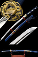 A collage of three images showcasing a Handmade Japanese Full Tang Sword with a 1060 carbon steel blade. The images display the sword from different angles, highlighting the blade's curved shape, the traditional handle with blue and black fabric, and the detailed dragon design on the tsuba.