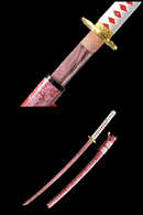 Handmade Japanese katana sword with a bold red blade and matching scabbard