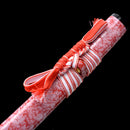 Handmade katana with a bold red blade and scabbard, perfect for samurai sword enthusiasts