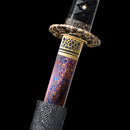 Handcrafted folded Damascus steel katana with a distinctive red blade, perfect for display