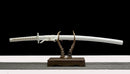 Ichigo Bankai Sword on display stand with white sheath and handle.
